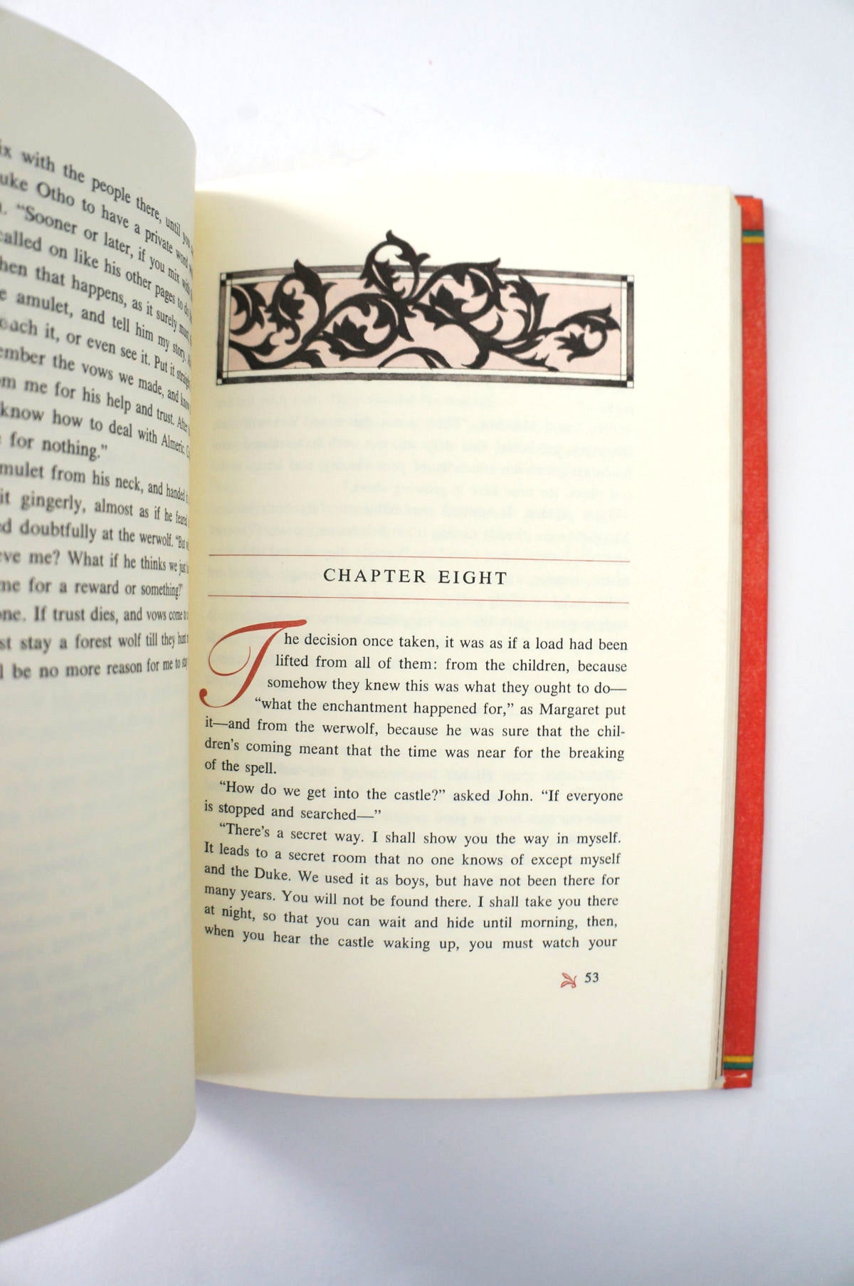 Open book with decorative text and chapter heading on a white background