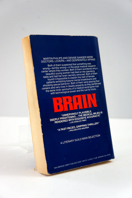 Book titled 'Brain' with a blue cover and red title on a white background