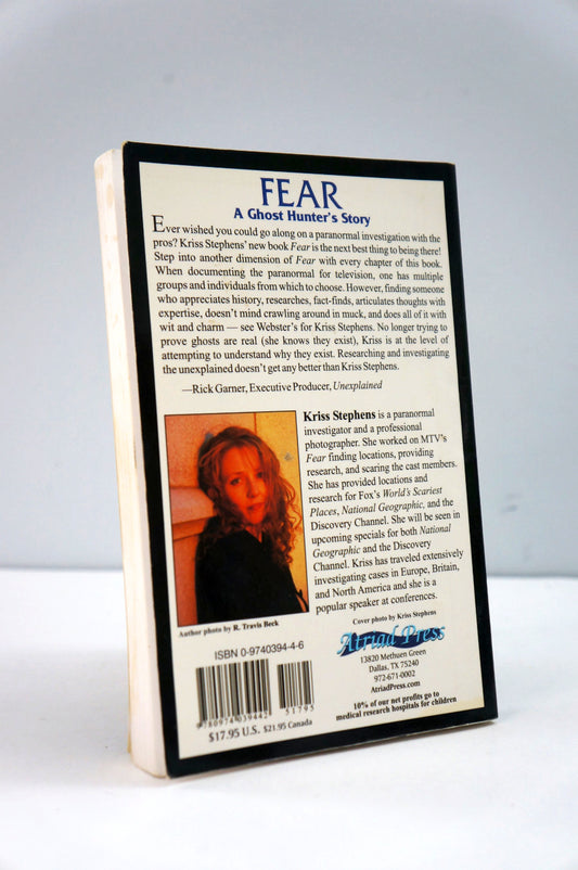 Book cover of 'Fear: A Ghost Hunter's Story' with text and a photo of a woman on a white background