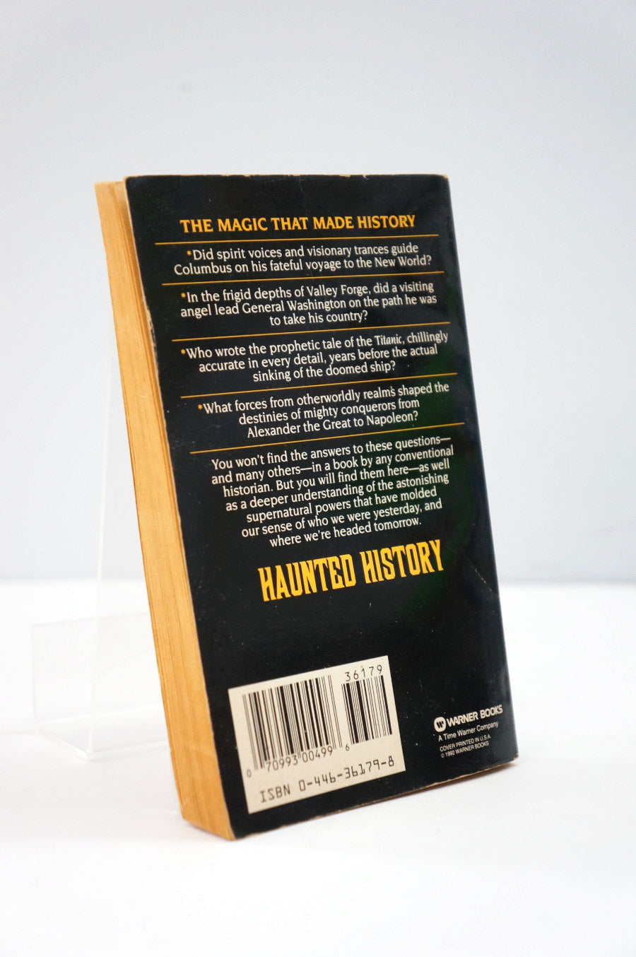 Back cover of a book titled 'Haunted History' with text and a barcode on a white background