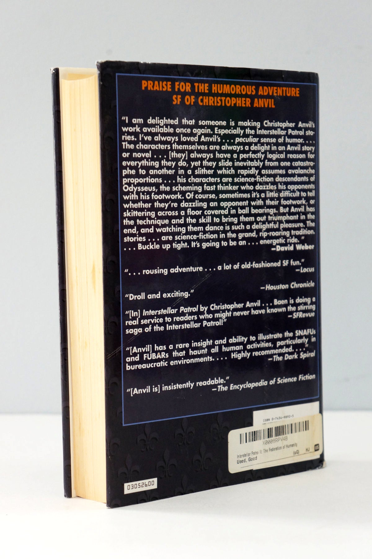 Back cover of a book with text and a barcode on a white background