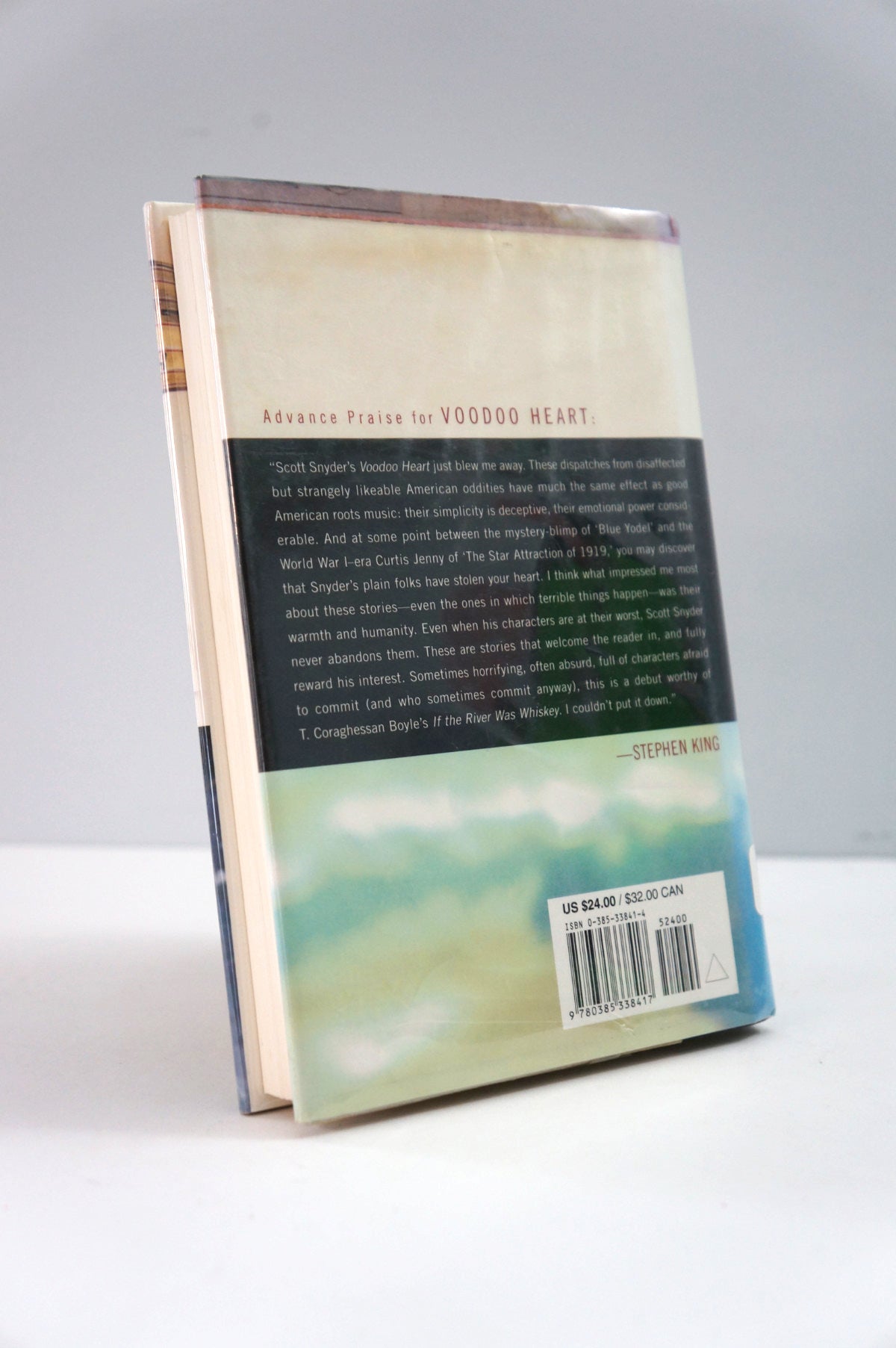 Book with a visible back cover on a white surface