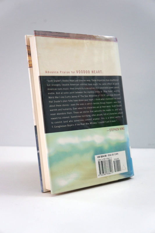 Book with a visible back cover on a white surface