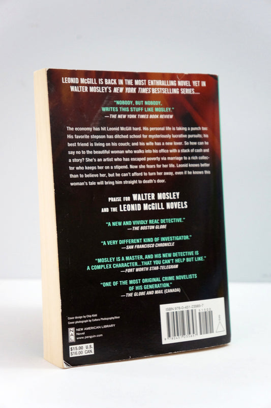 Back cover of a book with text and a barcode on a white background