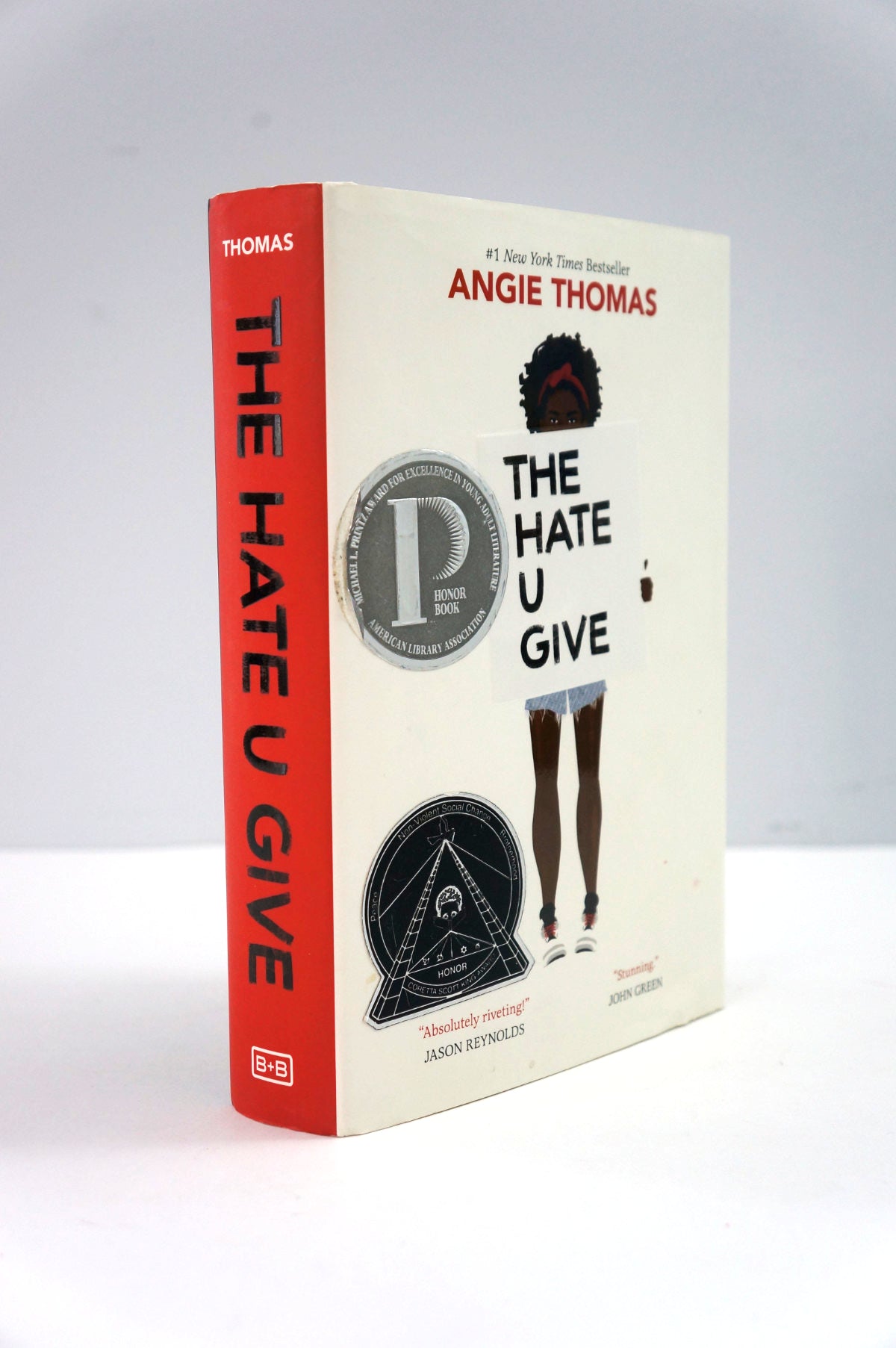 Book cover of 'The Hate U Give' by Angie Thomas on a white background