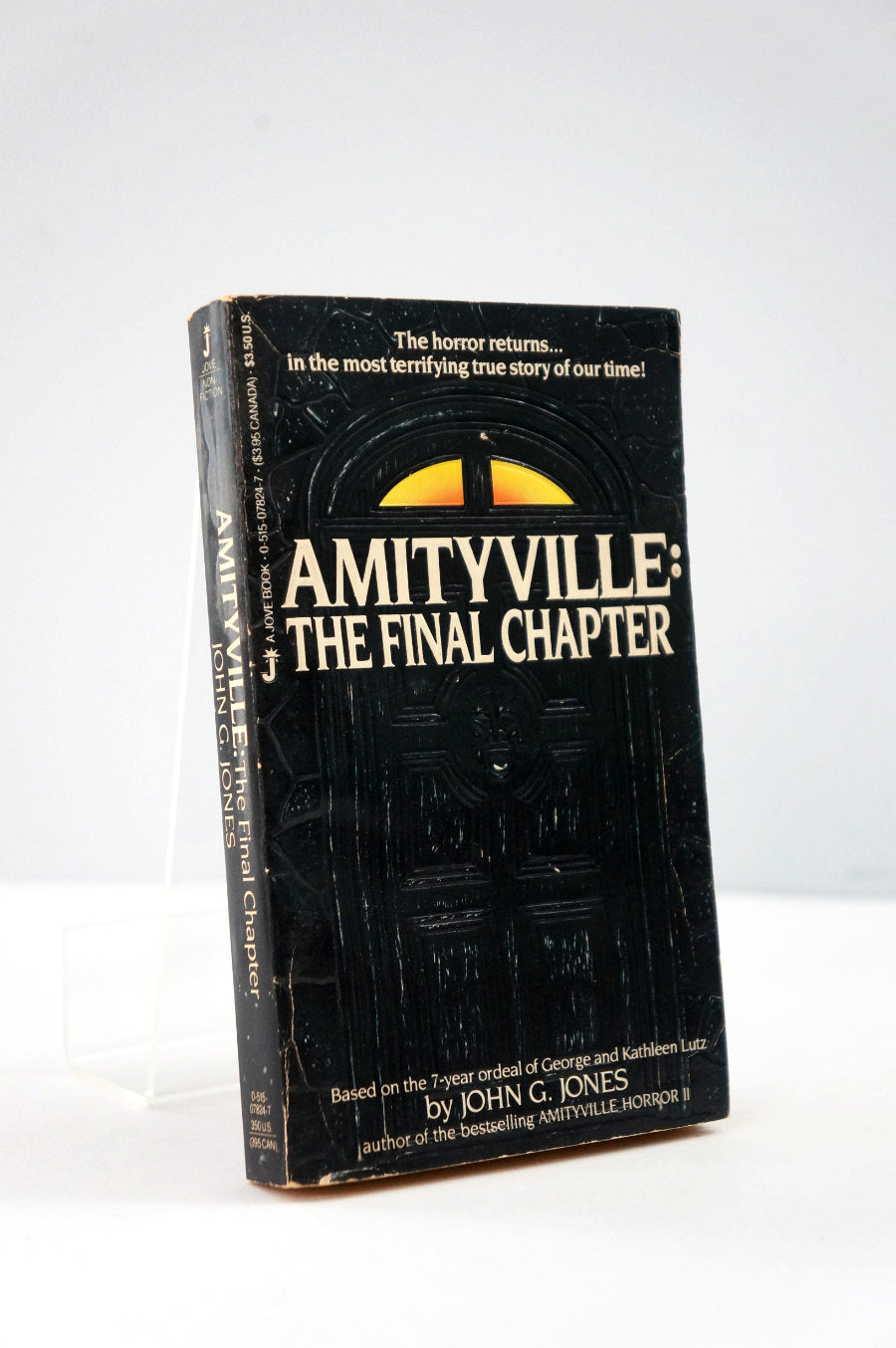 Book titled 'Amityville: The Final Chapter' on a white background