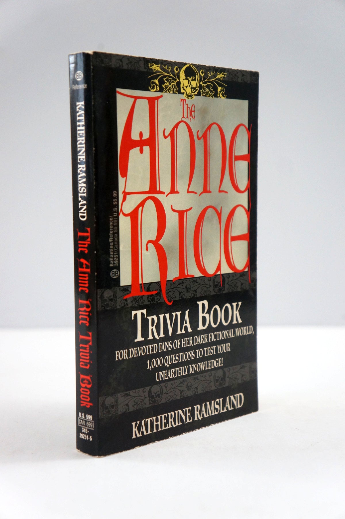 The Anne Rice Trivia Book by Katherine Ramsland, a black hardcover book with red and white lettering, photographed on a light gray background.