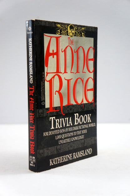 The Anne Rice Trivia Book by Katherine Ramsland, a black hardcover book with red and white lettering, photographed on a light gray background.