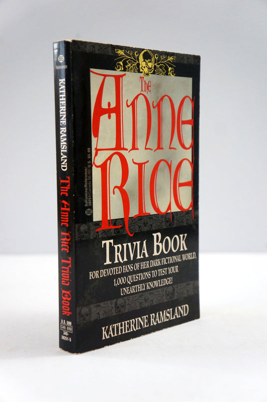 The Anne Rice Trivia Book by Katherine Ramsland, a black hardcover book with red and white lettering, photographed on a light gray background.