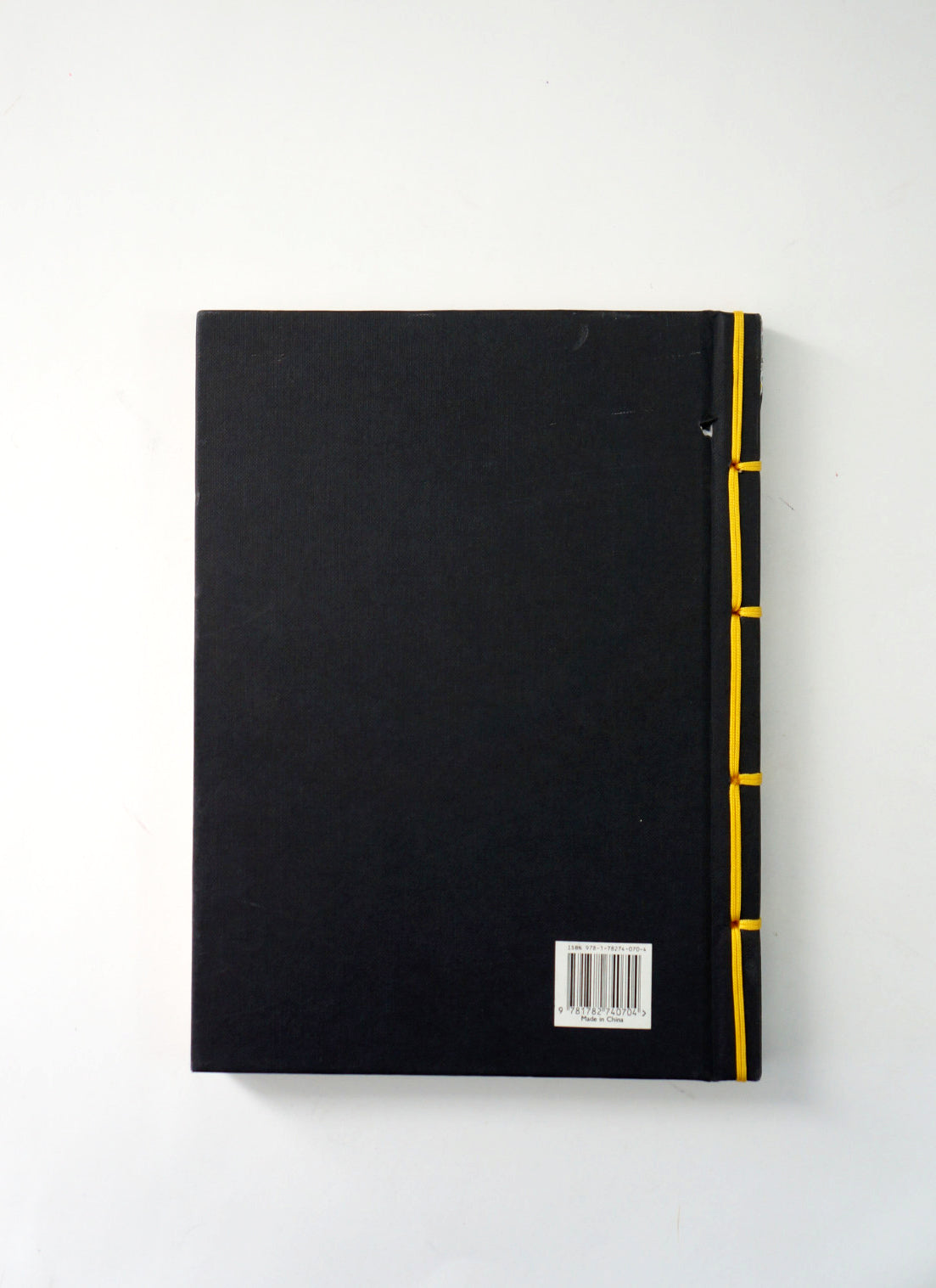 Back cover of the Prophet with yellow binding on a white background