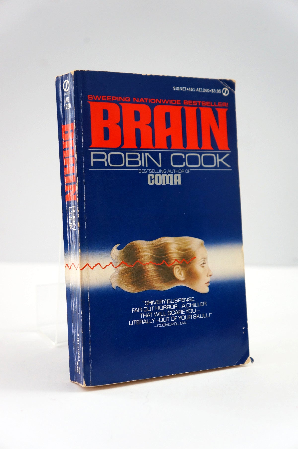 Book titled 'Brain' by Robin Cook on a white background