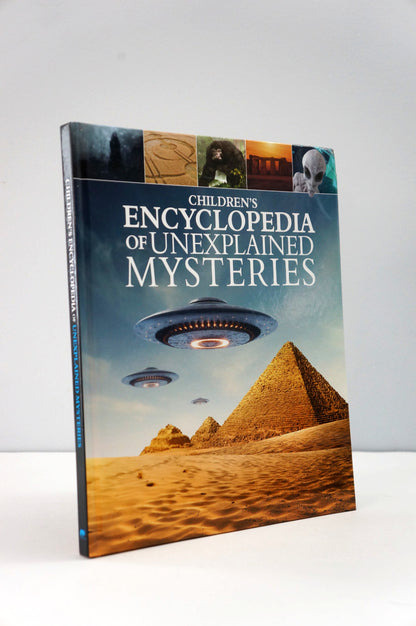 Children's Encyclopedia of Unexplained Mysteries book with UFO and pyramid images on a white background
