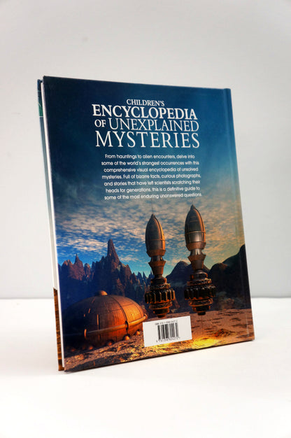 Book titled 'Children's Encyclopedia of Unexplained Mysteries' on a white background