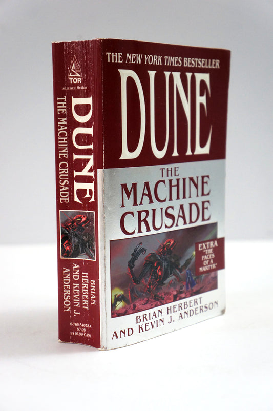 A vintage paperback copy of the book 'The Machine Crusade' by Brian Herbert and Kevin J. Anderson, showing the front cover and spine against a neutral light gray background.