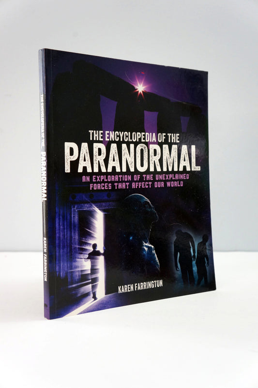 Book titled 'The Encyclopedia of the Paranormal' on a white background