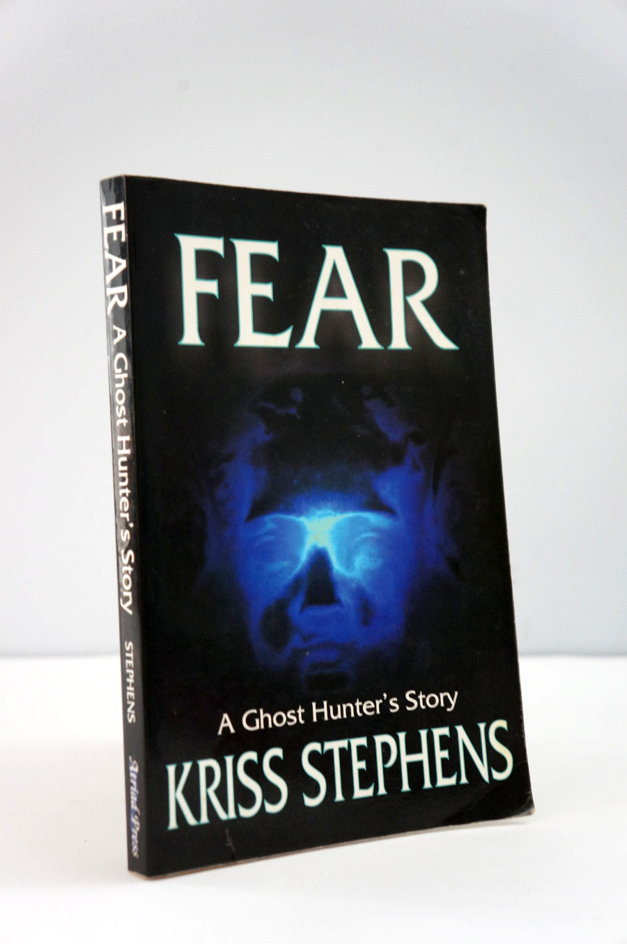 Book titled 'Fear: A Ghost Hunter's Story' by Kriss Stephens on a white background
