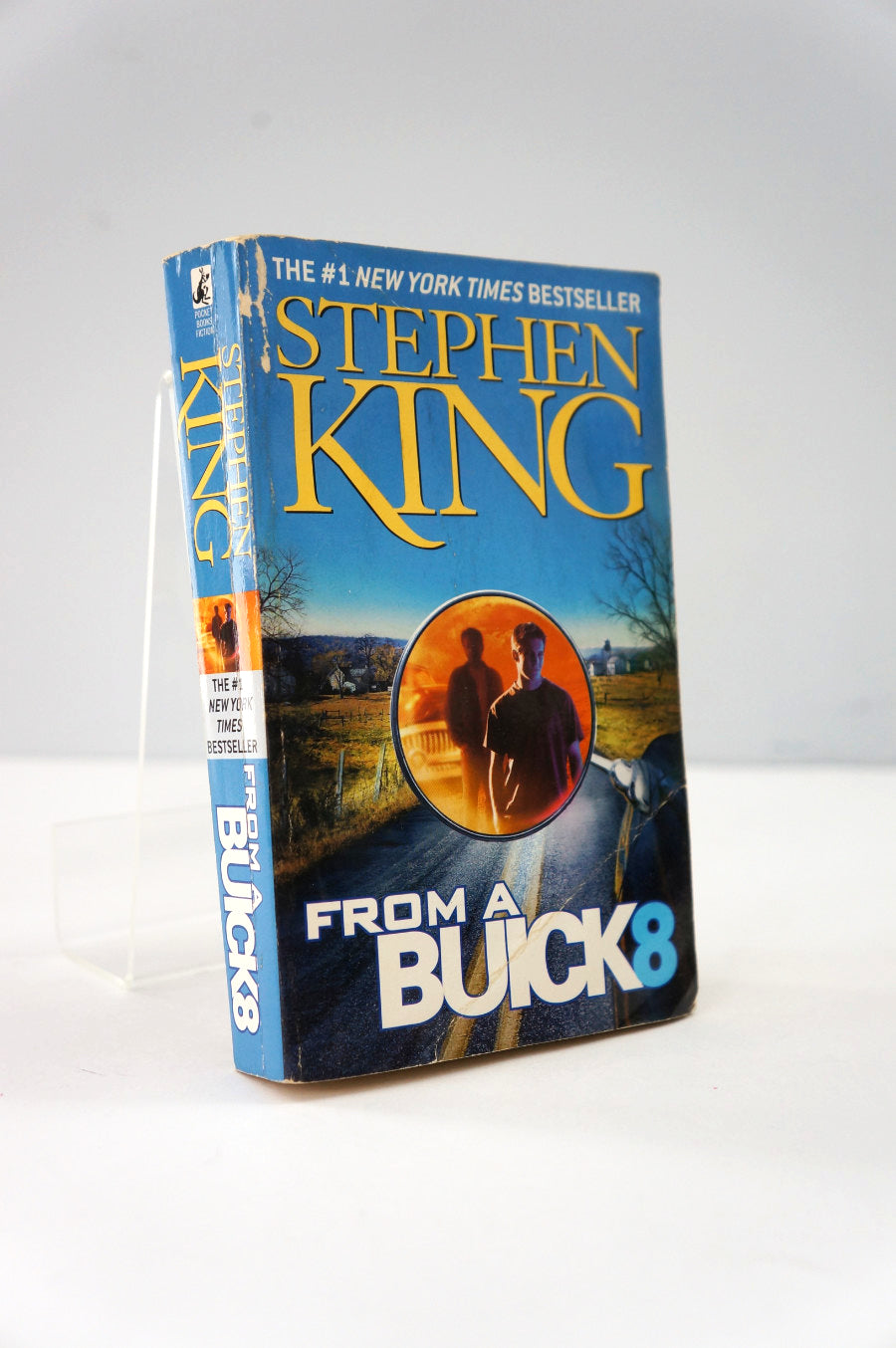 Book titled 'From a Buick 8' by Stephen King on a white background