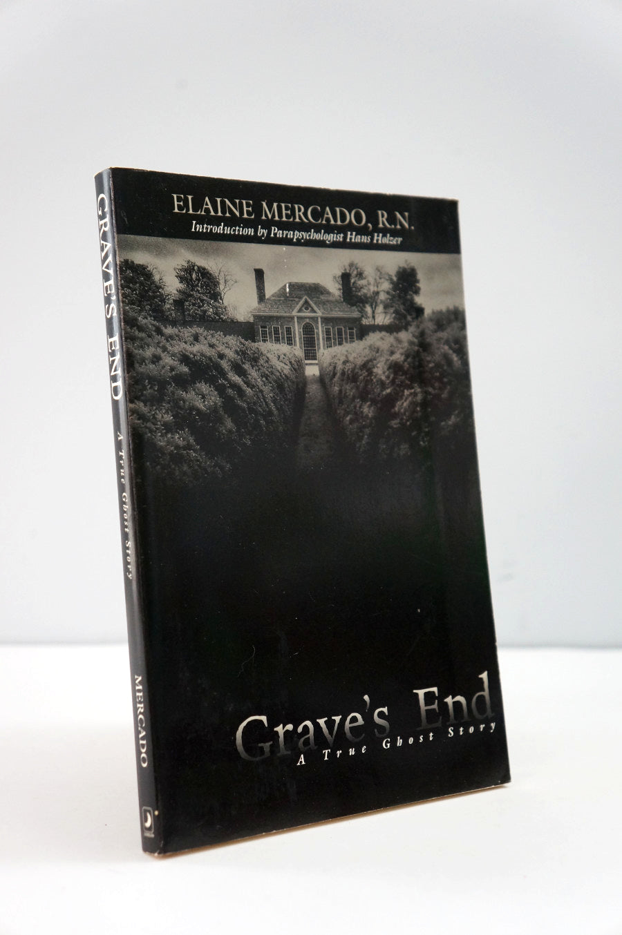 Book titled 'Grave's End' by Elaine Mercado, R.N. on a white background