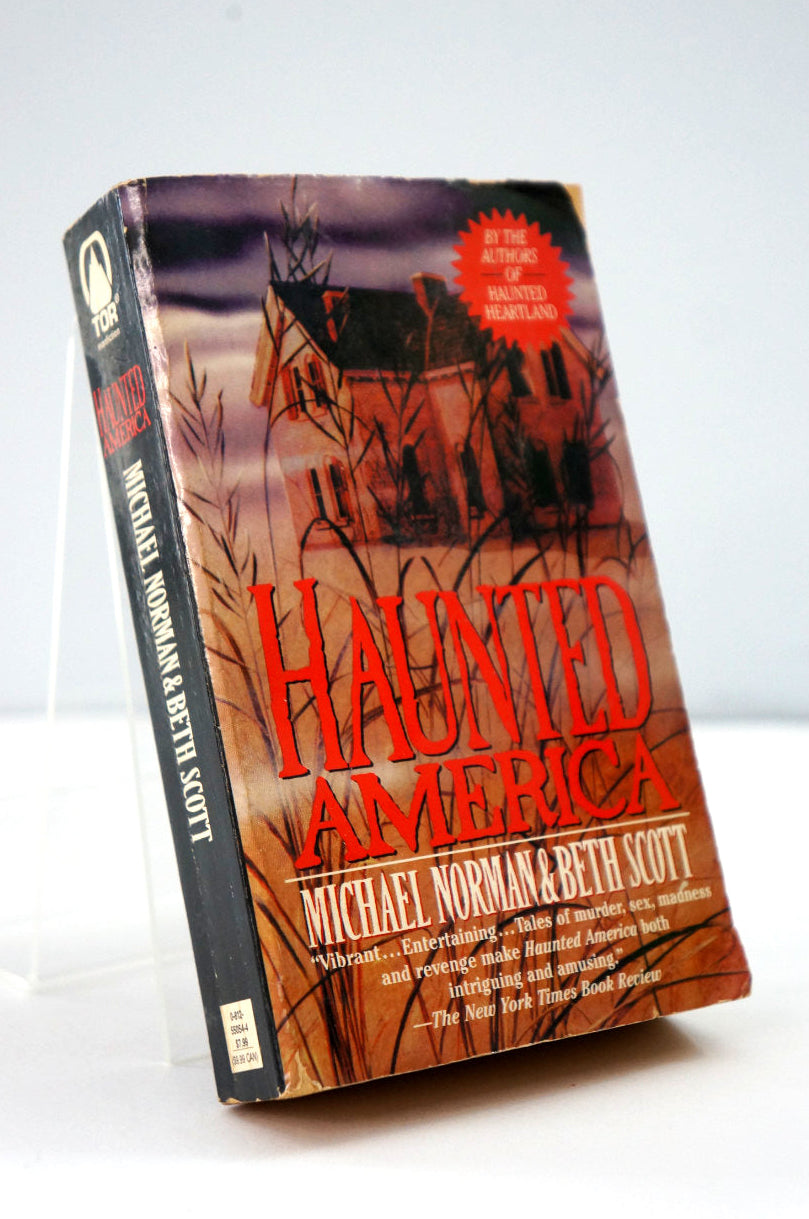 Book titled 'Haunted America' by Michael Norman and Beth Scott on a white background