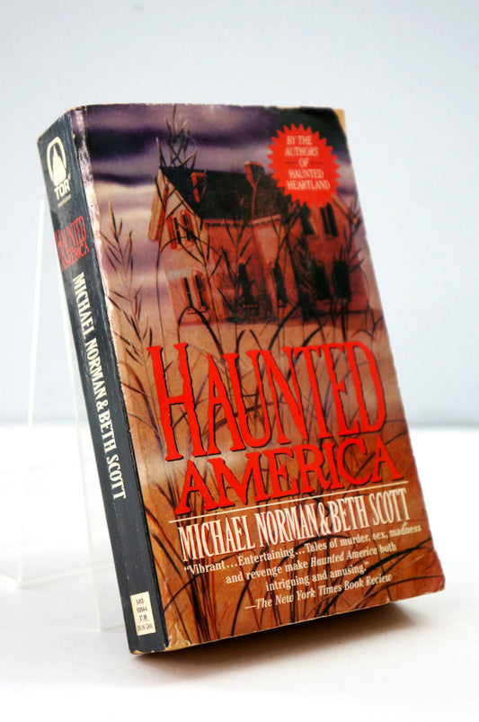 Book titled 'Haunted America' by Michael Norman and Beth Scott on a white background