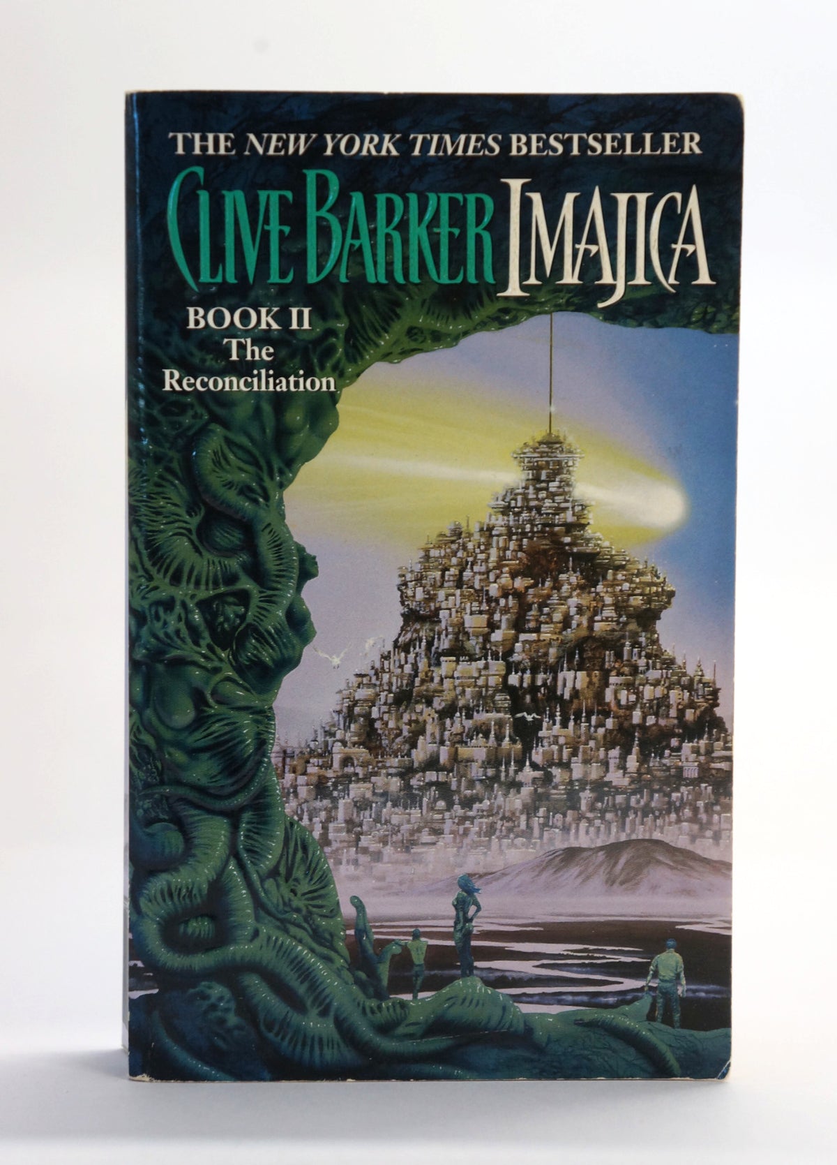 A vintage paperback book of Clive Barker's 'Imajica: Book II The Reconciliation' standing upright against a plain white background.