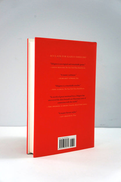 Red book with text and a barcode on a white background