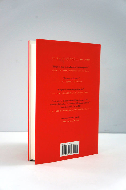 Red book with text and a barcode on a white background