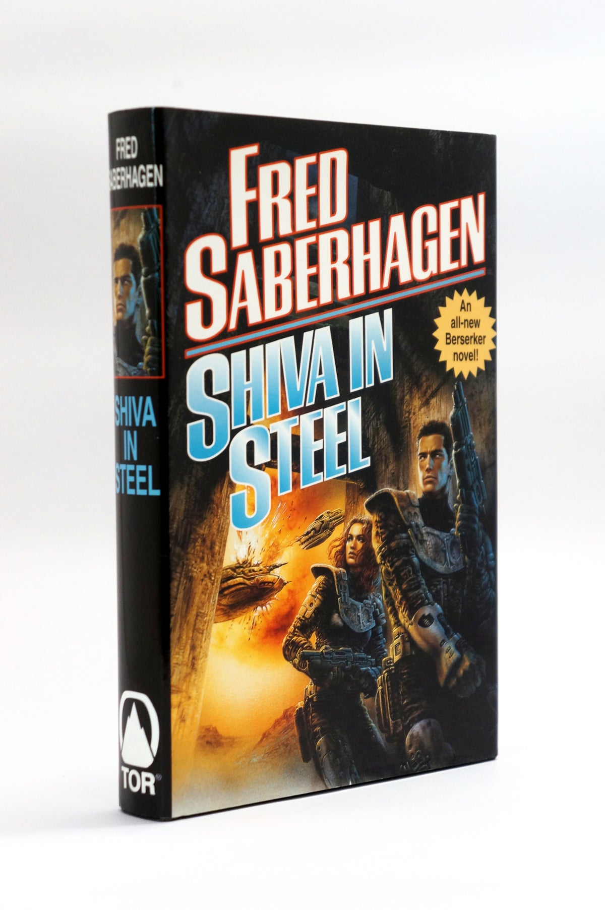 A hardcover book of Fred Saberhagen's science fiction novel 'Shiva in Steel' by Tor Books, shown standing upright at a slight angle on a white background.