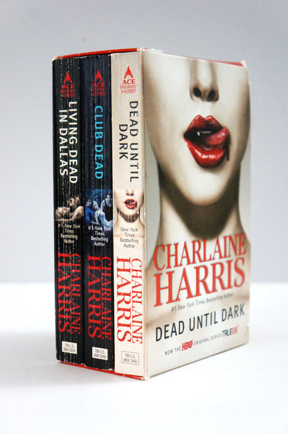 A boxed set of three Charlaine Harris novels from Ace Books, including 'Dead Until Dark', 'Club Dead', and 'Living Dead in Dallas', with the front cover showing a close-up of a woman's face with red lips.