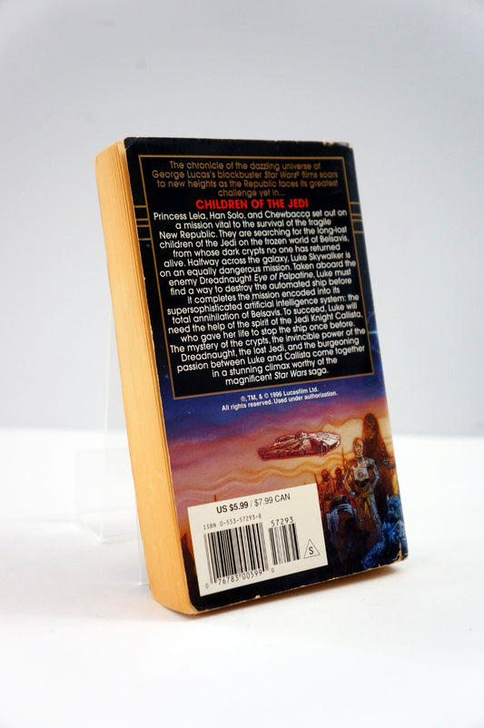Back cover of a book with text and a barcode on a white background