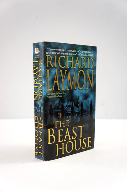 Book titled 'The Beast House' by Richard Laymon on a white background
