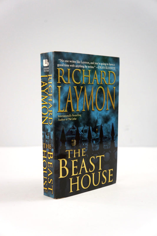 Book titled 'The Beast House' by Richard Laymon on a white background