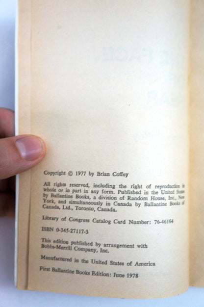 A close-up of a the Face of Fear's copyright page held by a hand, showing printed text on aged, yellowed paper.