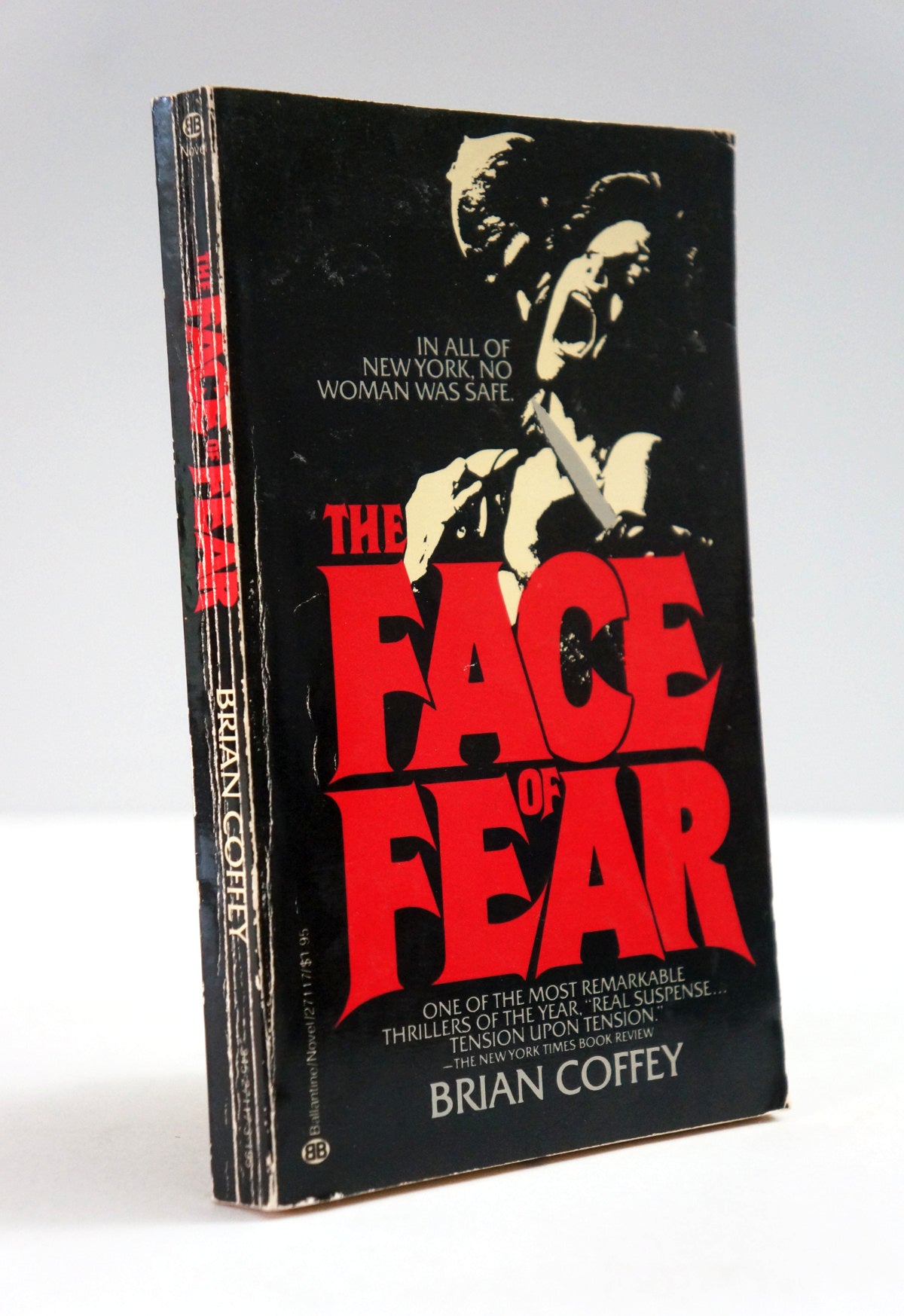 A vintage paperback book of Brian Coffey's 'The Face of Fear' standing upright at a slight angle. The cover is predominantly black with a high-contrast black-and-white illustration of a man's face holding a knife, and the title 'THE FACE OF FEAR' printed in large, bold red letters.