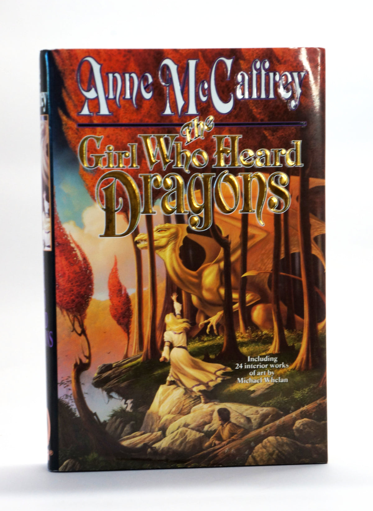 Anne McCaffrey's hardcover book 'The Girl Who Heard Dragons' standing upright on a white background.