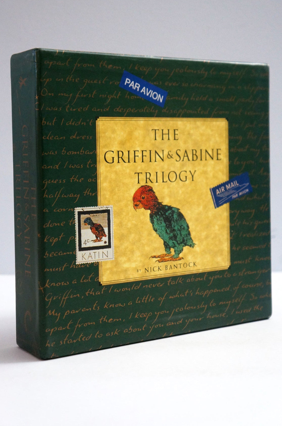 The Griffin & Sabine Trilogy book box by Nick Fantock, featuring a dark green cover with cursive writing and a central gold panel showing a green bird illustration.