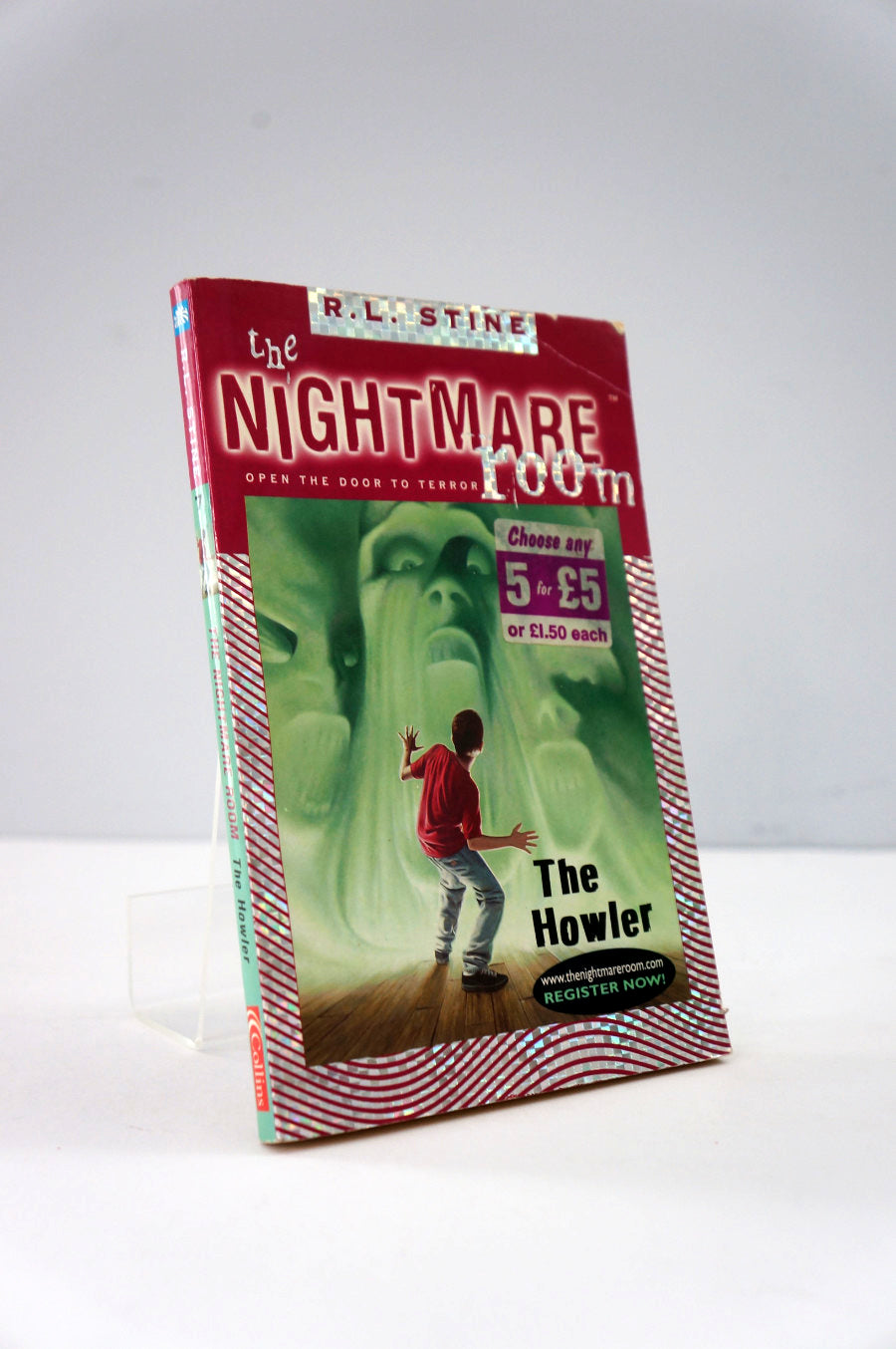 Book titled 'The Nightmare Room: The Howler' by R.L. Stine on a white background