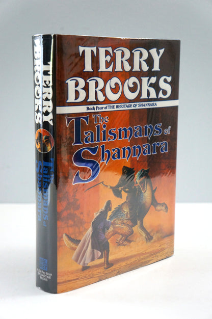 A hardcover book of Terry Brooks' 'The Talismans of Shannara' standing upright against a light gray background.